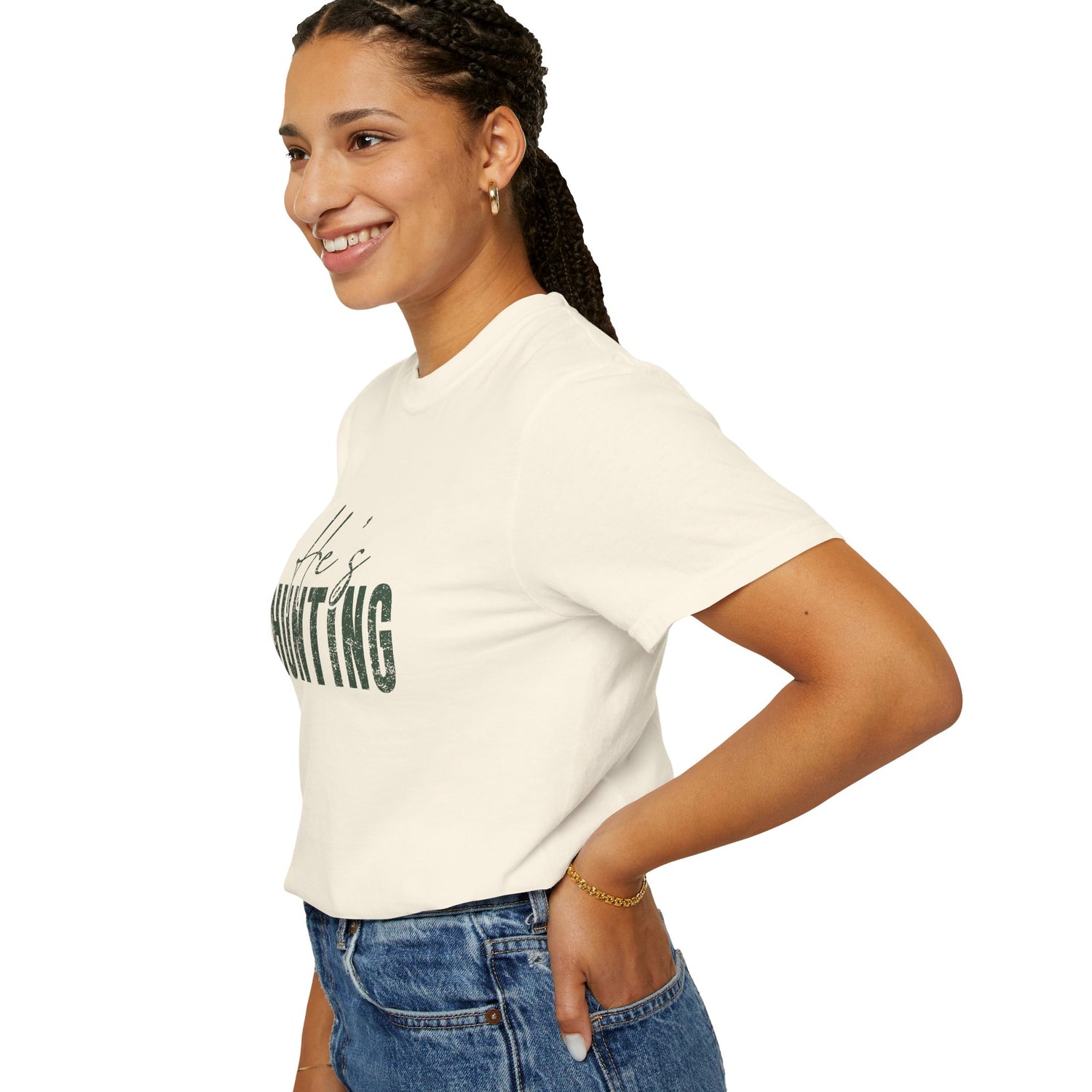 Woman wearing a white t-shirt with text on a plain background